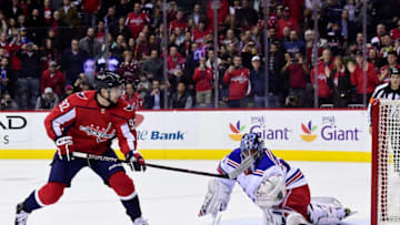 WASHINGTON, DC - MARCH 28: Henrik Lundqvist #30 of the New York Rangers makes a save against Evgeny Kuznetsov #92 of the Washington Capitals on a penalty shot in the first period at Capital One Arena on March 28, 2018 in Washington, DC. (Photo by Patrick McDermott/NHLI via Getty Images)