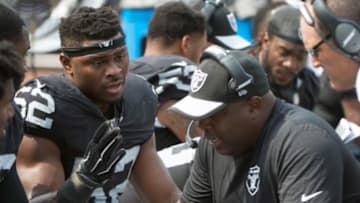 September 13, 2015; Oakland, CA, USA; Oakland Raiders defensive end Khalil Mack (52) talks to defensive line coach Jethro Franklin (right) during the second quarter against the Cincinnati Bengals at O.co Coliseum. The Bengals defeated the Raiders 33-13. Mandatory Credit: Kyle Terada-USA TODAY Sports