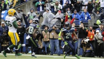 Jan 18, 2015; Seattle, WA, USA; Seattle Seahawks running back Marshawn Lynch (24) scores a go ahead touchdown during the fourth quarter against the Green Bay Packers in the NFC Championship Game at CenturyLink Field. Mandatory Credit: Steven Bisig-USA TODAY Sports