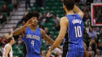 Dec 3, 2015; Salt Lake City, UT, USA; Orlando Magic guard Elfrid Payton (4) and forward Evan Fournier (10) celebrate after beating the Utah Jazz 103-94 at Vivint Smart Home Arena. Mandatory Credit: Jeff Swinger-USA TODAY Sports
