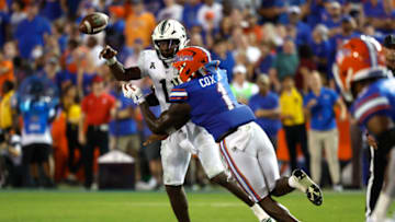 Sep 17, 2022; Gainesville, Florida, USA; Florida Gators linebacker Brenton Cox Jr. (1) pressures South Florida Bulls quarterback Gerry Bohanon (11) during the second half at Ben Hill Griffin Stadium. Mandatory Credit: Kim Klement-USA TODAY Sports