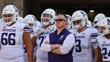 Oct 29, 2022; Iowa City, Iowa, USA; Northwestern head coach Pat Fitzgerald and the Wildcats team before the game against the Iowa Hawkeyes at Kinnick Stadium. Mandatory Credit: Jeffrey Becker-USA TODAY Sports