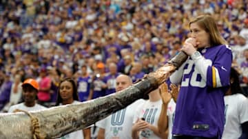 MINNEAPOLIS, MN - OCTOBER 13: Lindsay Whalen #13 of the Minnesota Lynx sounds the horn as the Minnesota Lynx are honored for their WNBA Championship before the game between the Minnesota Vikings and the Carolina Panthers on October 13, 2013 at Mall of America Field at the Hubert H. Humphrey Metrodome in Minneapolis, Minnesota. The Panthers defeated the Vikings 35-10. (Photo by Hannah Foslien/Getty Images)