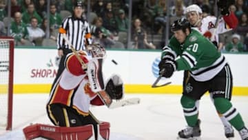 Dec 17, 2015; Dallas, TX, USA; Calgary Flames goalie Karri Ramo (31) stops a shot by Dallas Stars center Cody Eakin (20) during the second period at the American Airlines Center. Mandatory Credit: Jerome Miron-USA TODAY Sports
