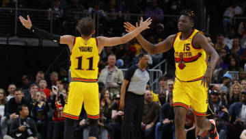 ATLANTA, GA - MARCH 25: Trae Young #11 reacts with Clint Capela #15 of the Atlanta Hawks during the first half against the Golden State Warriors at State Farm Arena on March 25, 2022 in Atlanta, Georgia. NOTE TO USER: User expressly acknowledges and agrees that, by downloading and or using this photograph, User is consenting to the terms and conditions of the Getty Images License Agreement. (Photo by Todd Kirkland/Getty Images)
