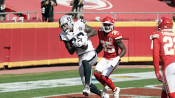 Las Vegas Raiders tight end Darren Waller (83) catches a 5-yard touchdown pass as Kansas City Chiefs cornerback Charvarius Ward (35) defends -Mandatory Credit: Kirby Lee-USA TODAY Sports