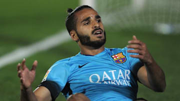 Barcelona's Brazilian defender Douglas sits on the field during the Spanish Copa del Rey (King's Cup) Round of 32 first leg football match CF Villanovense vs FC Barcelona at the Romero Cuerda stadium in Villanueva de la Serena on October 28, 2015. AFP PHOTO / CRISTINA QUICLER (Photo credit should read CRISTINA QUICLER/AFP/Getty Images)