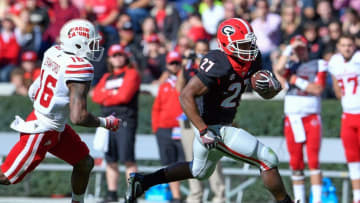 Nov 19, 2016; Athens, GA, USA; Georgia Bulldogs running back Nick Chubb (27) runs past Louisiana-Lafayette Ragin Cajuns defensive back Travis Crawford (16) during the first half at Sanford Stadium. Mandatory Credit: Dale Zanine-USA TODAY Sports