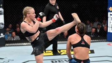 CHICAGO, IL - JUNE 08: (L-R) Valentina Shevchenko of Kyrgyzstan knocks out Jessica Eye in their women's flyweight championship bout during the UFC 238 event at the United Center on June 8, 2019 in Chicago, Illinois. (Photo by Jeff Bottari/Zuffa LLC/Zuffa LLC via Getty Images)