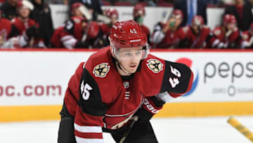 GLENDALE, AZ - NOVEMBER 15: Josh Archibald #45 of the Arizona Coyotes gets ready during a faceoff against the Nashville Predators at Gila River Arena on November 15, 2018 in Glendale, Arizona. (Photo by Norm Hall/NHLI via Getty Images)