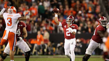 SANTA CLARA, CA - JANUARY 07: Jalen Hurts #2 of the Alabama Crimson Tide attempts a pass against the Clemson Tigers in the CFP National Championship presented by AT&T at Levi's Stadium on January 7, 2019 in Santa Clara, California. (Photo by Christian Petersen/Getty Images)