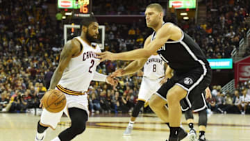 Dec 23, 2016; Cleveland, OH, USA; Brooklyn Nets center Brook Lopez (11) defends Cleveland Cavaliers guard Kyrie Irving (2) during the first half at Quicken Loans Arena. Mandatory Credit: Ken Blaze-USA TODAY Sports