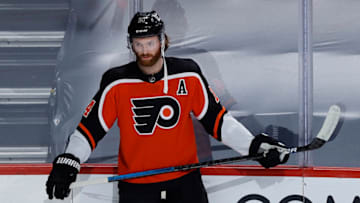 PHILADELPHIA, PENNSYLVANIA - FEBRUARY 24: Sean Couturier #14 of the Philadelphia Flyers looks on before playing against the New York Rangers at Wells Fargo Center on February 24, 2021 in Philadelphia, Pennsylvania. (Photo by Tim Nwachukwu/Getty Images)