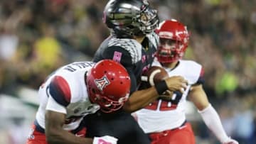 Oct 2, 2014; Eugene, OR, USA; Oregon Ducks quarterback Marcus Mariota (8) makes a catch thrown by Oregon Ducks running back Royce Freeman (21) for a touchdown in the second quarter against the Arizona Wildcats at Autzen Stadium. Mandatory Credit: Scott Olmos-USA TODAY Sports