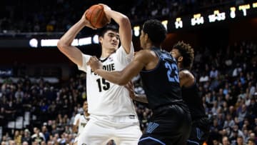 UNCASVILLE, CT - NOVEMBER 21: Zach Edey #15 of the Purdue University Boilermakers pulls in a rebound over Jermaine Samuels #23 of the Villanova Wildcats during the second half of a game at Mohegan Sun Arena on November 21, 2021 in Uncasville, Connecticut. (Photo by Dustin Satloff/Getty Images)