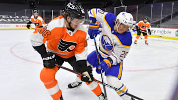 Jan 19, 2021; Philadelphia, Pennsylvania, USA; Philadelphia Flyers left wing Joel Farabee (86) and Buffalo Sabres center Cody Eakin (20) battle for the puck during the first period at Wells Fargo Center. Mandatory Credit: Eric Hartline-USA TODAY Sports