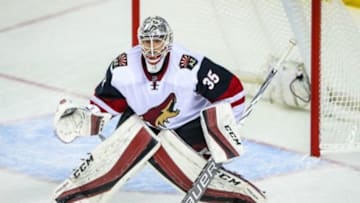 Jan 7, 2016; Calgary, Alberta, CAN; Arizona Coyotes goalie Louis Domingue (35) guards his net against the Calgary Flames during the second period at Scotiabank Saddledome. Arizona Coyotes won 2-1. Mandatory Credit: Sergei Belski-USA TODAY Sports
