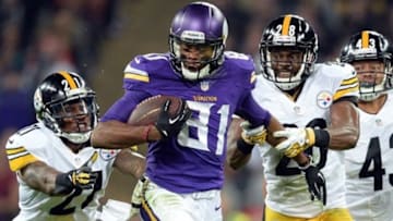 Sep 29, 2013; London, UNITED KINGDOM; Minnesota Vikings wide receiver Jerome Simpson (81) runs between Pittsburgh Steelers cornerback Cortez Allen (28) and safety Robert Golden (21) during the NFL International Series game at Wembley Stadium. Mandatory Credit: Bob Martin-USA TODAY Sports