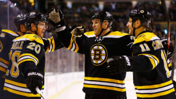 BOSTON, MA - MARCH 9: Daniel Paille #20 of the Boston Bruins celebrates with teammates Shawn Thornton #22 and Gregory Campbell #11 of the Boston Bruins after scoring a goal in the first period against the Philadelphia Flyers during the game on March 9, 2013 at TD Garden in Boston, Massachusetts. (Photo by Jared Wickerham/Getty Images)