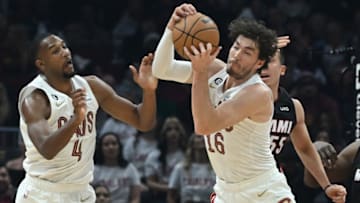 Nov 20, 2022; Cleveland, Ohio, USA; Cleveland Cavaliers forward Cedi Osman (16) grabs a rebound in front of forward Evan Mobley (4) and Miami Heat guard Duncan Robinson (55) during the first half at Rocket Mortgage FieldHouse. Mandatory Credit: Ken Blaze-USA TODAY Sports