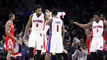 Nov 30, 2015; Auburn Hills, MI, USA; Detroit Pistons center Andre Drummond (0) celebrates with guard Reggie Jackson (1) during the fourth quarter against the Houston Rockets at The Palace of Auburn Hills. Pistons win 116-105. Mandatory Credit: Raj Mehta-USA TODAY Sports
