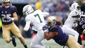 Sep 17, 2016; Seattle, WA, USA; Washington Huskies defensive lineman Elijah Qualls (11) sacks Portland State Vikings quarterback Alex Kuresa (7) during the second quarter at Husky Stadium. Mandatory Credit: Jennifer Buchanan-USA TODAY Sports