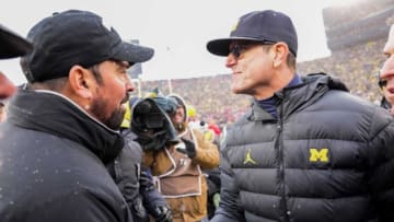 Ohio State coach Ryan Day shakes hands with Michigan coach Jim Harbaugh following Saturday's game.Img Ohio State Buckeyes 1 1 0euspm7b L1741352332
