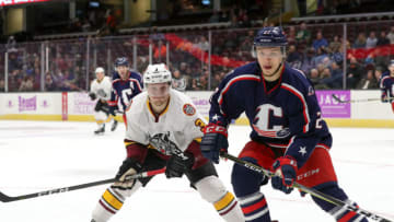 CLEVELAND, OH - MARCH 20: Chicago Wolves left wing Teemu Pulkkinen (3) and Cleveland Monsters center Calvin Thurkauf (27) follow the puck into the corner during the third period of the American Hockey League game between the Chicago Wolves and Cleveland Monsters on March 20, 2018, at Quicken Loans Arena in Cleveland, OH. Chicago defeated Cleveland 3-2 in overtime. (Photo by Frank Jansky/Icon Sportswire via Getty Images)