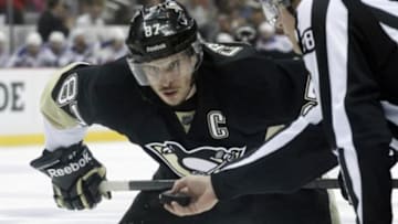 May 13, 2014; Pittsburgh, PA, USA; Pittsburgh Penguins center Sidney Crosby (87) waits for the puck drop on a face-off against the New York Rangers during the second period in game seven of the second round of the 2014 Stanley Cup Playoffs at the CONSOL Energy Center. The Rangers won 2-1 and took the series 4 games to 3. Mandatory Credit: Charles LeClaire-USA TODAY Sports