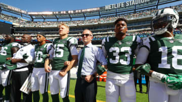 EAST RUTHERFORD, NJ - SEPTEMBER 24: Jermaine Kearse #10 and Josh McCown #15, Jamal Adams #33 and Christopher Johnson CEO of the New York Jets stand in unison with their team during the National Anthem prior to an NFL game against the Miami Dolphins at MetLife Stadium on September 24, 2017 in East Rutherford, New Jersey. (Photo by Al Bello/Getty Images)