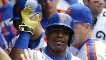 May 22, 2016; New York City, NY, USA; New York Mets center fielder Yoenis Cespedes (52) celebrates with teammates in the dugout after scoring a run in the fourth inning against the Milwaukee Brewers at Citi Field. Mandatory Credit: Noah K. Murray-USA TODAY Sports
