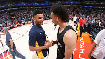 SALT LAKE CITY, UT - JULY 5: Lonnie Walker IV #4 of the San Antonio Spurs shakes hands with Naz Mitrou-Long #30 of the Utah Jazz on July 5, 2018 at Vivint Smart Home Arena in Salt Lake City, Utah. Copyright 2018 NBAE (Photo by Joe Murphy/NBAE via Getty Images)