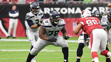 GLENDALE, ARIZONA - SEPTEMBER 29: DJ Fluker #78 of the Seattle Seahawks looks to help block Corey Peters #98 of the Arizona Cardinals at State Farm Stadium on September 29, 2019 in Glendale, Arizona. (Photo by Norm Hall/Getty Images)