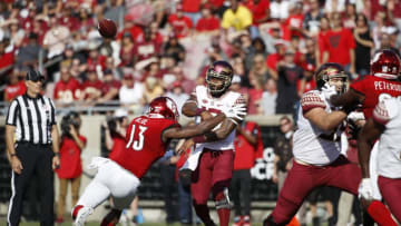 LOUISVILLE, KY - SEPTEMBER 29: Deondre Francois #12 of the Florida State Seminoles throws a pass while under pressure from P.J. Blue #13 of the Louisville Cardinals in the second quarter of the game at Cardinal Stadium on September 29, 2018 in Louisville, Kentucky. (Photo by Joe Robbins/Getty Images)