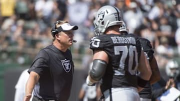 September 20, 2015; Oakland, CA, USA; Oakland Raiders head coach Jack Del Rio (left) high-fives guard Tony Bergstrom (70) against the Baltimore Ravens during the first quarter at O.co Coliseum. Mandatory Credit: Kyle Terada-USA TODAY Sports
