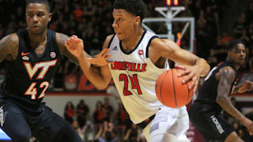BLACKSBURG, VA - FEBRUARY 04: Dwayne Sutton #24 of the Louisville Cardinals looks to dribble while being guarded by Ahmed Hill #13 and Ty Outlaw #42 of the Virginia Tech Hokies in the first half at Cassell Coliseum on February 04, 2019 in Blacksburg, Virginia. (Photo by Lauren Rakes/Getty Images)