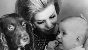 circa 1950: A trio of mother, baby and dog in a family life scene. (Photo by Keystone/Getty Images)
