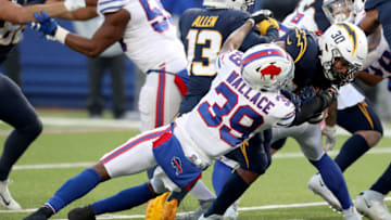 ORCHARD PARK, NEW YORK - NOVEMBER 29: Levi Wallace #39 of the Buffalo Bills tackles Austin Ekeler #30 of the Los Angeles Chargers during the fourth quarter at Bills Stadium on November 29, 2020 in Orchard Park, New York. (Photo by Bryan Bennett/Getty Images)