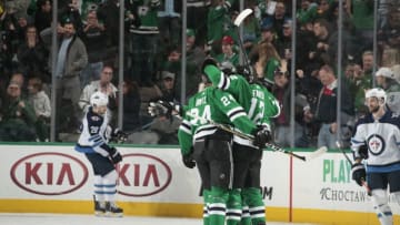 DALLAS, TX - JANUARY 19: Radek Faksa #12, Roope Hintz #24 and the Dallas Stars celebrate a goal against the Winnipeg Jets at the American Airlines Center on January 19, 2019 in Dallas, Texas. (Photo by Glenn James/NHLI via Getty Images)