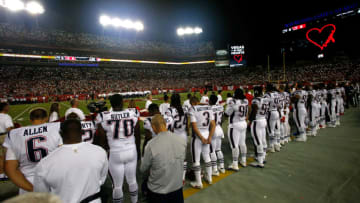 TAMPA, FL - OCTOBER 5: Fans light up the light on their cell phones as they join the New England Patriots and the Tampa Bay Buccaneers in a moment of silence in horning the victims of the Las Vegas mass shooting before the start of an NFL football game on October 5, 2017 at Raymond James Stadium in Tampa, Florida. (Photo by Brian Blanco/Getty Images)