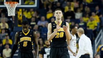 ANN ARBOR, MI - MARCH 5: Jarrod Uthoff #20 of the Iowa Hawkeyes celebrates as he heads to the bench with Anthony Clemmons #5 of the Iowa Hawkeyes during the second half of a 71-61 win over the Michigan Wolverines at Crisler Arena on March 5, 2016 in Ann Arbor, Michigan. (Photo by Duane Burleson/Getty Images)
