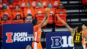 Jan 29, 2021; Champaign, Illinois, USA; Illinois Fighting Illini guard Trent Frazier (1) makes a three point basket against the Iowa Hawkeyes during the second half at the State Farm Center. Mandatory Credit: Patrick Gorski-USA TODAY Sports
