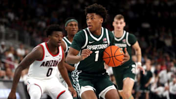 Michigan State Spartans guard Jeremy Fears Jr. (1) controls the ball as Arizona Wildcats guard Jaden Bradley (0) looks on during the Acrisure Classic in Palm Desert, Calif., on Thanksgiving Day, Nov. 23, 2023.