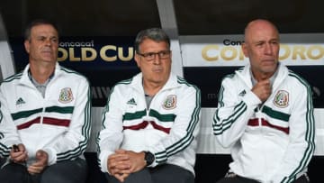 Mexico's coach Gerardo 'Tata' Martino (C) sits on the team bench at the start of the CONCACAF Gold Cup Group A match between Mexico and Canada on June 19, 2019 at Broncos Mile High stadium in Denver, Colorado. (Photo by Robyn Beck / AFP) (Photo credit should read ROBYN BECK/AFP/Getty Images)
