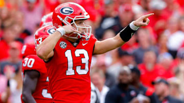 ATHENS, GEORGIA - NOVEMBER 05: Stetson Bennett #13 of the Georgia Bulldogs celebrates after scoring a touchdown against the Tennessee Volunteers during the first quarter at Sanford Stadium on November 05, 2022 in Athens, Georgia. (Photo by Todd Kirkland/Getty Images)