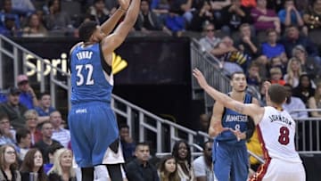 Oct 8, 2016; Kansas City , MO, USA; Minnesota Timberwolves forward Karl-Anthony Towns (32) shoots a three point basket as Miami Heat guard Tyler Johnson (8) defends during the second half at Sprint Center. Minnesota won 109 - 100. Mandatory Credit: Denny Medley-USA TODAY Sports