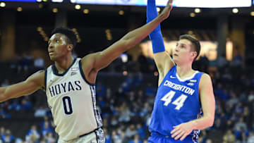 Feb 14, 2022; Omaha, Nebraska, USA; Creighton Bluejays forward Ryan Hawkins (44) scores on a three point shot against Georgetown Hoyas guard Aminu Mohammed (0) in the second half at CHI Health Center Omaha. Mandatory Credit: Steven Branscombe-USA TODAY Sports