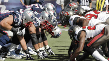 The New England Patriots and the Tampa Bay Buccaneers at the snap at the line of scrimmage (Photo by Winslow Townson/Getty Images)