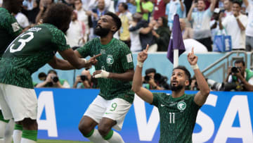 Saudi Arabian players celebrate score after they took a 2-1 lead over Argentina while producing the biggest upset of the World Cup thus far. (Photo by Visionhaus/Getty Images)