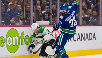 Apr 18, 2022; Vancouver, British Columbia, CAN; Vancouver Canucks defenseman Oliver Ekman-Larsson (23) checks Dallas Stars forward Joe Pavelski (16) in the second period at Rogers Arena. Mandatory Credit: Bob Frid-USA TODAY Sports